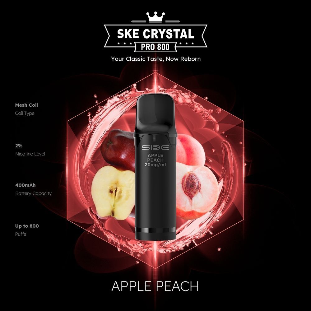SKE Crystal 800 Pro Pods - Apple Peach SKE Crystal Pro Pods Apple Peach 20mg, schwarze Hülle, Pfirsich- und Apfelabbildung im Hintergrund, Angaben: 2% Nikotin, 400mAh, 800 Züge