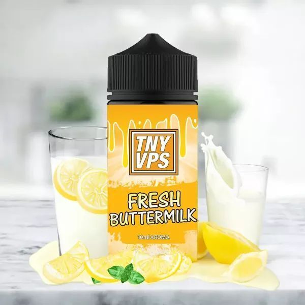 Aroma Fresh Buttermilk von Tony Vapes Tony Vapes Aroma Flasche mit der Aufschrift Fresh Buttermilk, umgeben von Zitronenscheiben und Gläsern mit Milch.